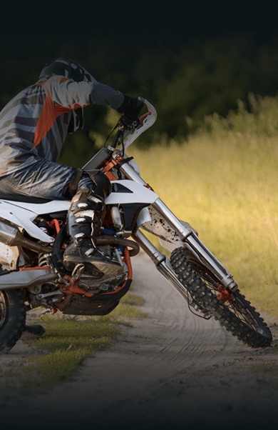 Dirt bike rider leaning into a turn